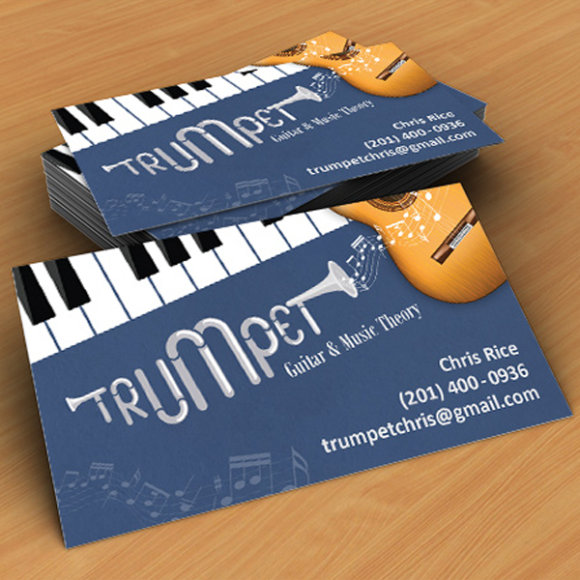 a pair of business cards designed to look like a piano keyboard.