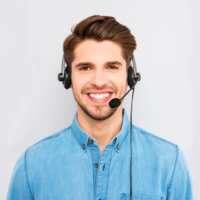 a man wearing a headset and smiling.