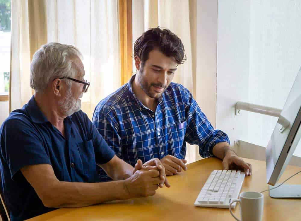 Computer Technician Providing in home computer help for senior man.