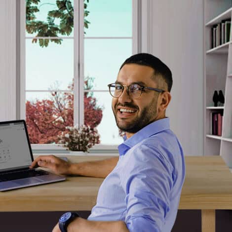 Smiling Man at Laptop