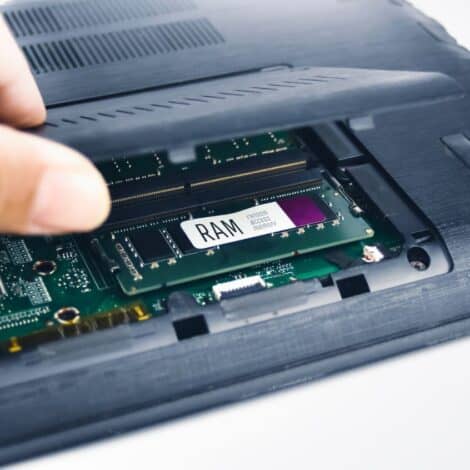Laptop with RAM tray opened.