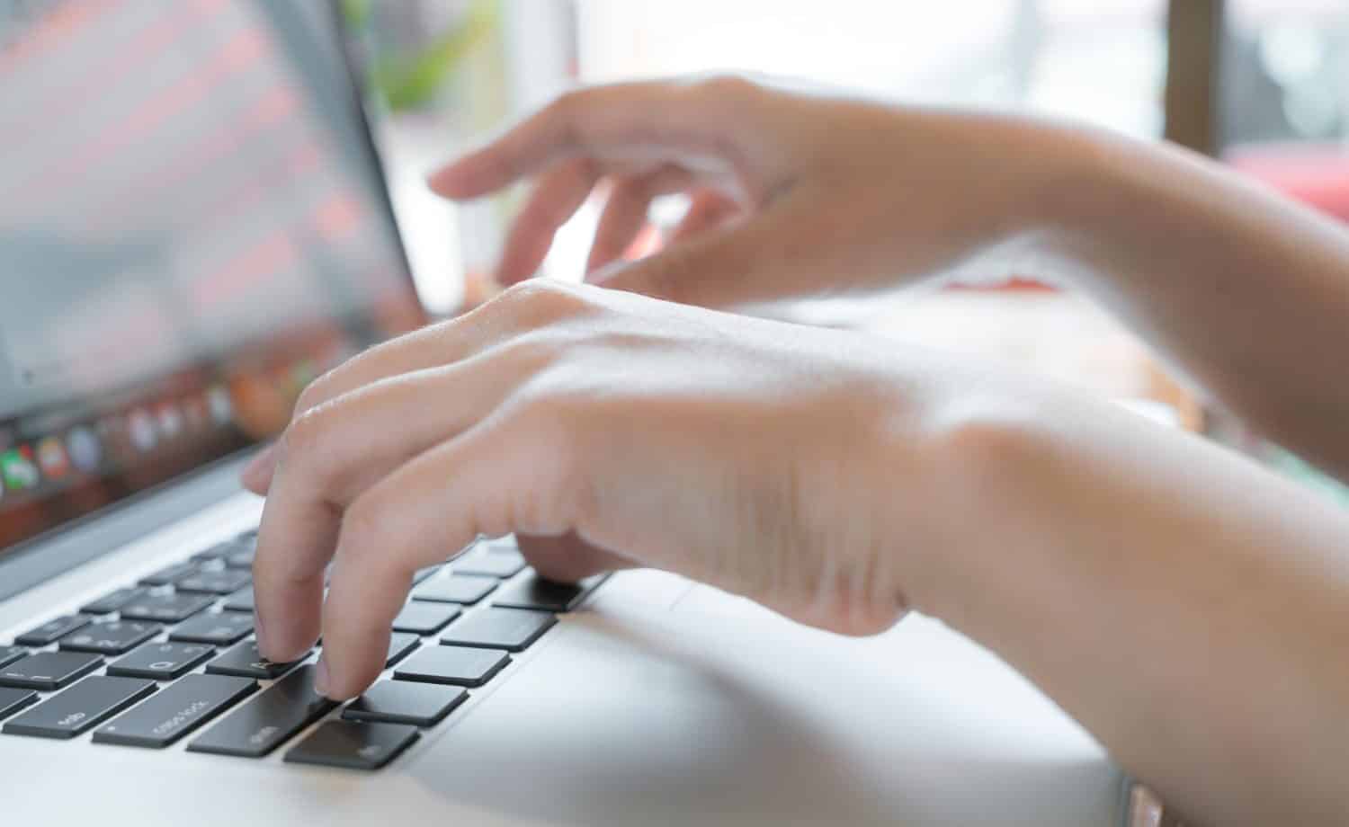 Closeup of woman typing