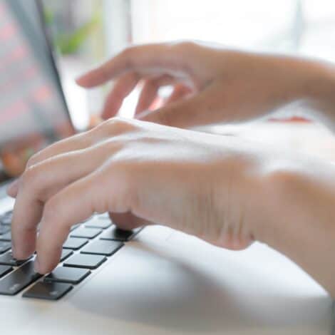 Closeup of woman typing