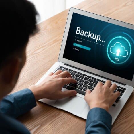 man performing a data backup on his laptop