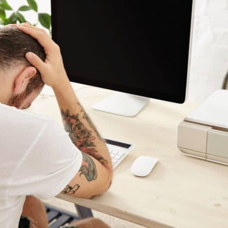 Man frustrated by computer that won't turn on