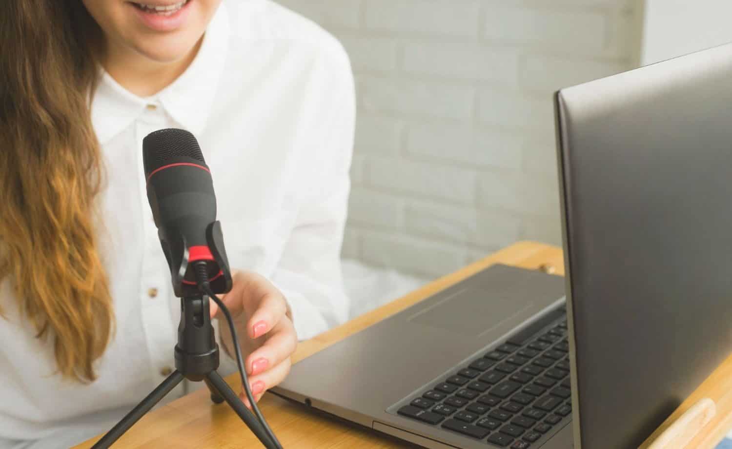 Person at laptop with a USB microphone