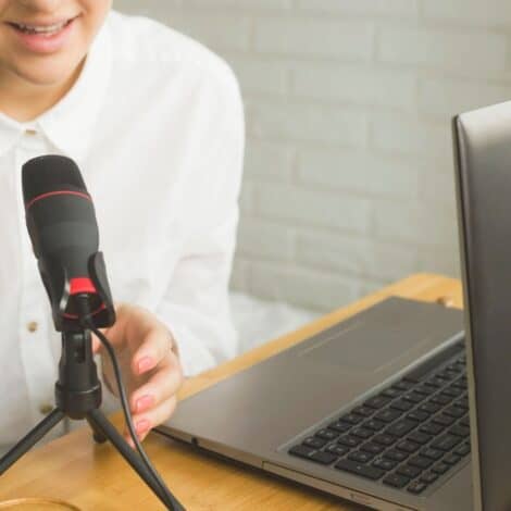 Person at laptop with a USB microphone