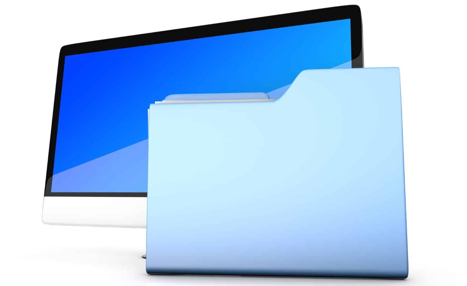 A computer monitor and file folder