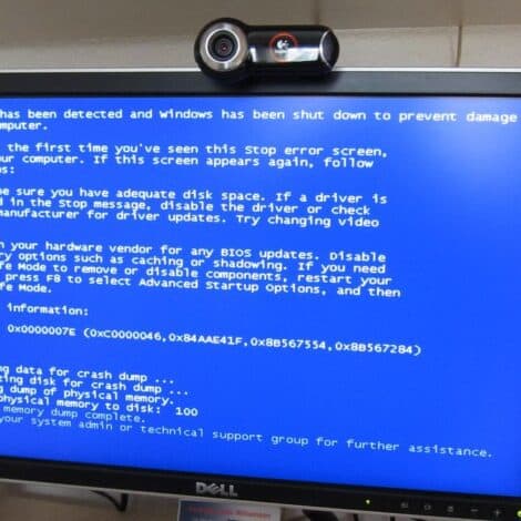 a computer with a blue screen of death error message on the screen