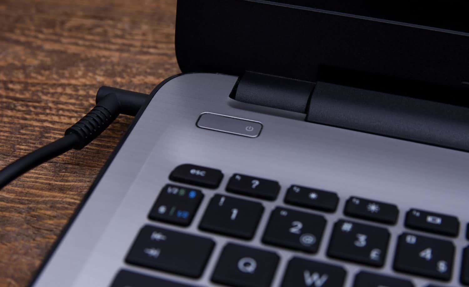 a laptop plugged in to charge