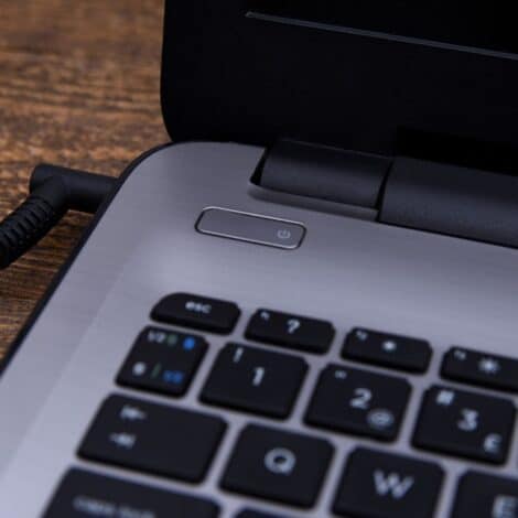 a laptop plugged in to charge