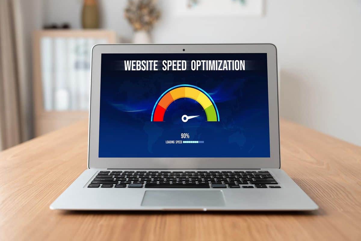 Laptop displaying speed optimization progress at 90%, highlighting computer tune-up services by Geeks On Command.